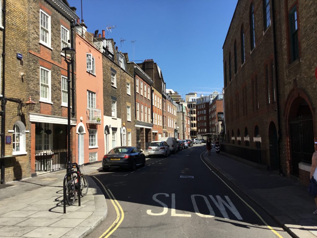 Wildred Street in London England. Cars park along the curb of this now restful piece of London.