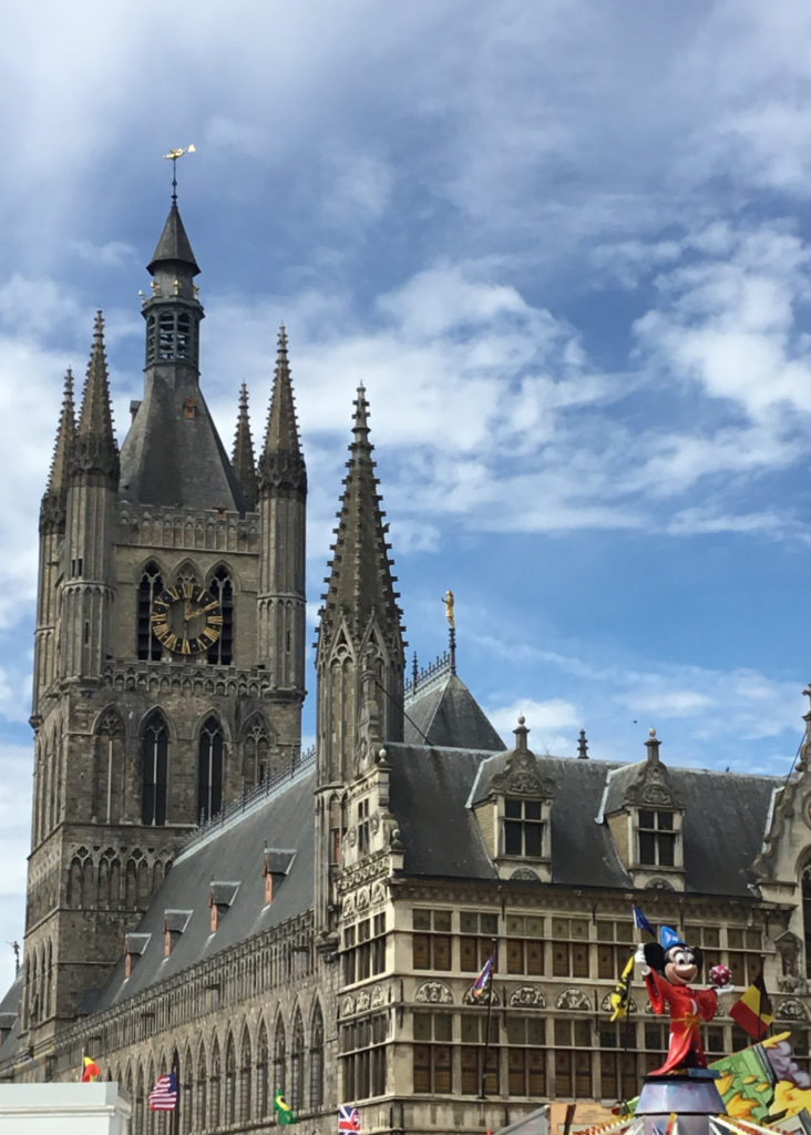 The Cloth at Ieper (Ypres), Belgium. A nearby midway features Mickey Mouse in his sorcerer's apprentice costume from Fantasia.