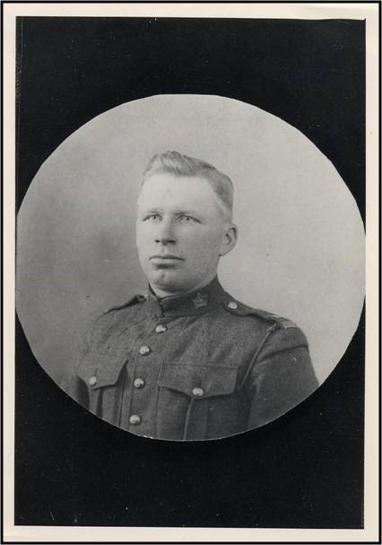 Portrait of Private Ole Berget, in the uniform of the Canadian Expeditionary Force. The tunic includes maple leaf shaperd general service collar badges and Canada shoulder titles. 
