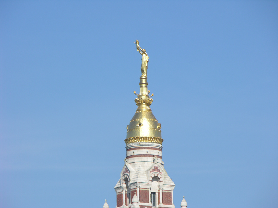 View of the Virgin Mary atop of Basilica Notre-Dame.