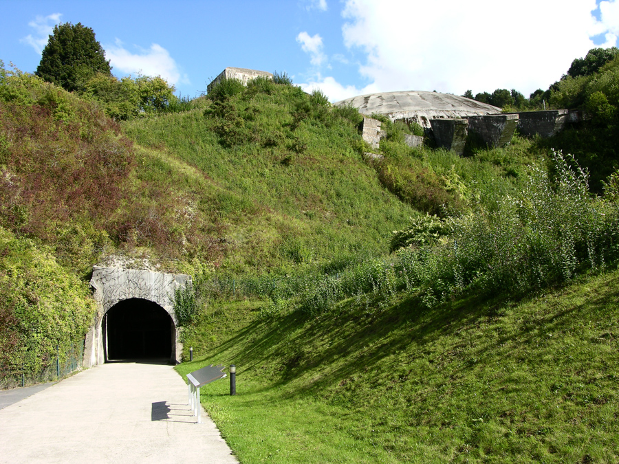Rocket launch base in France showing tunnel, hills and cement structures.