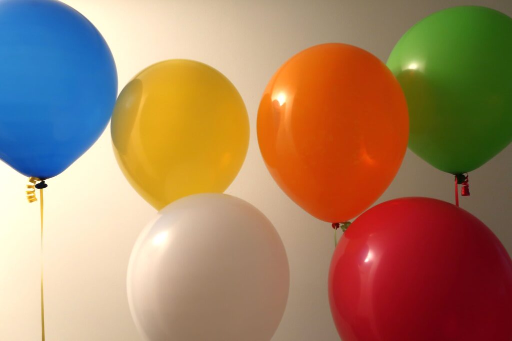 A selection of six colourful balloons.