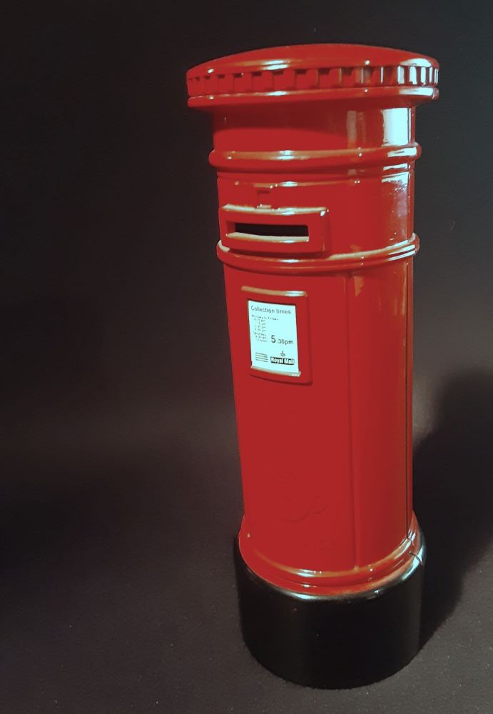 Red pillar box giving times of delivery.