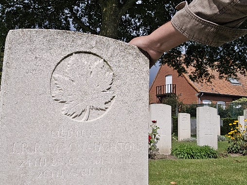 Hand upon the headstone.