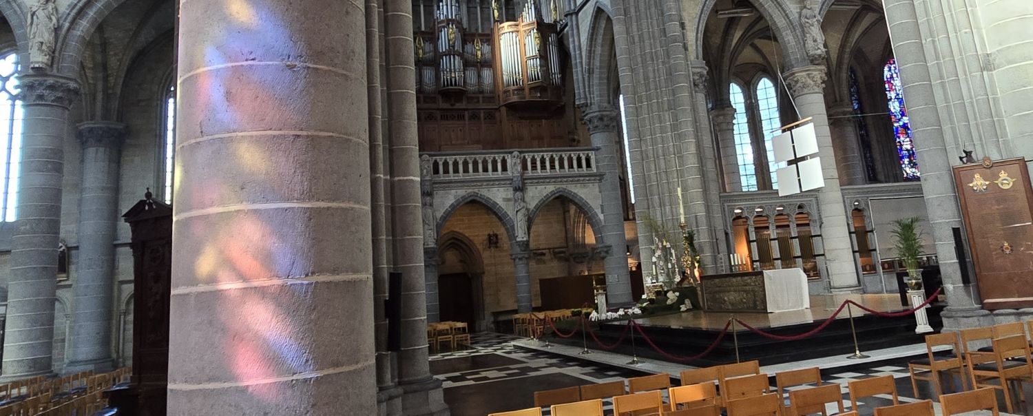 Coloured light refracted against a column.